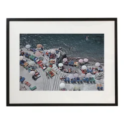 Positano Beach Framed Print by Slim Aarons