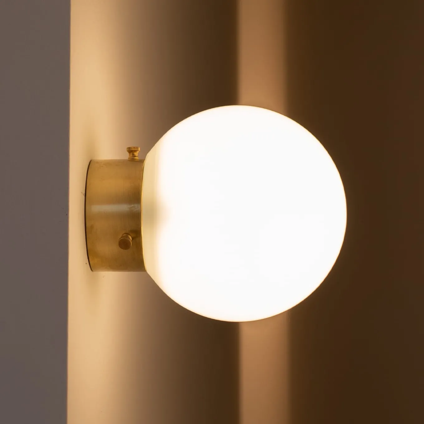 Ro' PS Round Milky Glass With Gold Finish Brass Base Applique