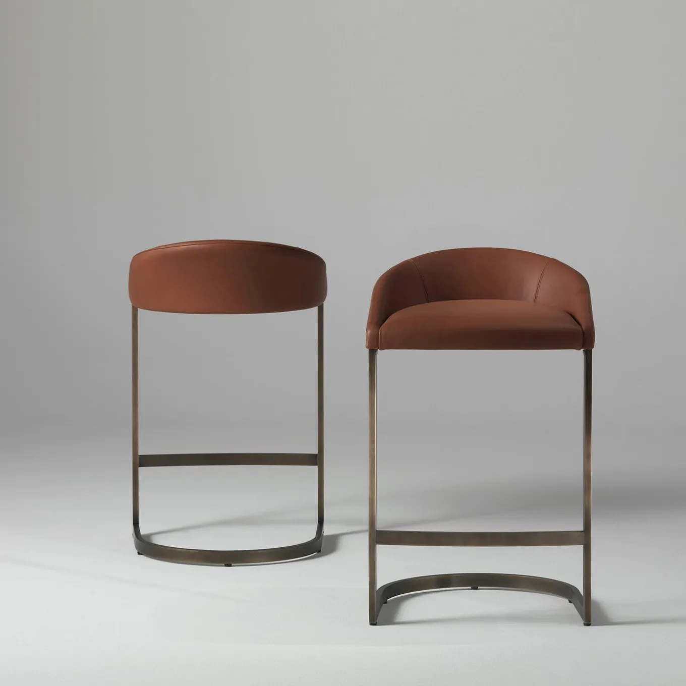 Sign brown leather with bronze finish brass base high stool